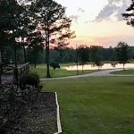 Fall sunset overlooking the pond and A-frame cabin at Deer Run RV Park in Troy, Alabama