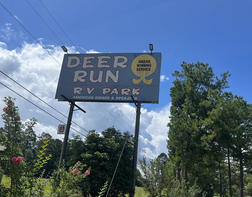 Entrance sign at Deer Run RV Park in Troy, Alabama welcoming campers for the 2026 camping season