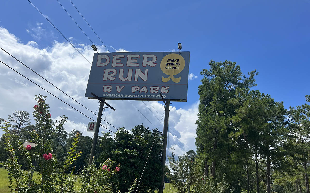 Entrance sign at Deer Run RV Park in Troy, Alabama welcoming campers for the 2026 camping season