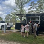 Families enjoying a food truck event at Deer Run RV Park in Troy, Alabama