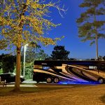 Luxury motorhome enjoying a peaceful summer evening at Deer Run RV Park in Troy, Alabama