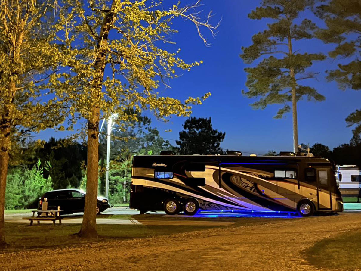 Luxury motorhome enjoying a peaceful summer evening at Deer Run RV Park in Troy, Alabama