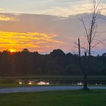 Summer sunset over the pond at Deer Run RV Park in Troy, Alabama