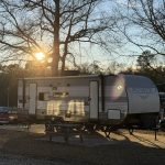 Travel trailer campsite during a late summer afternoon at Deer Run RV Park in Troy, Alabama