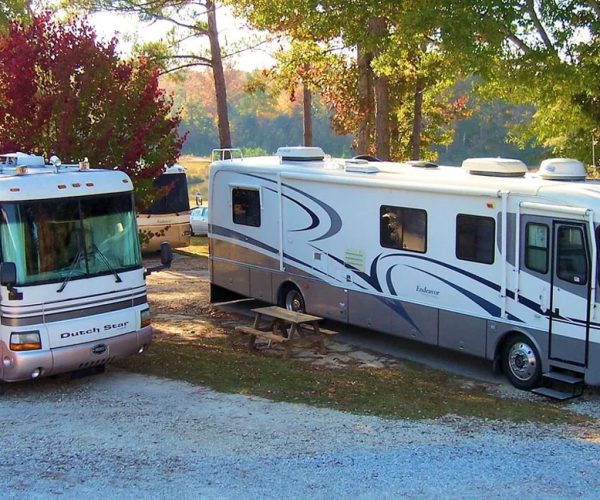 Shaded RV Sites at Deer Run RV Park – Troy, Alabama RVs on shaded campsites among trees at Deer Run RV Park in Troy, Alabama