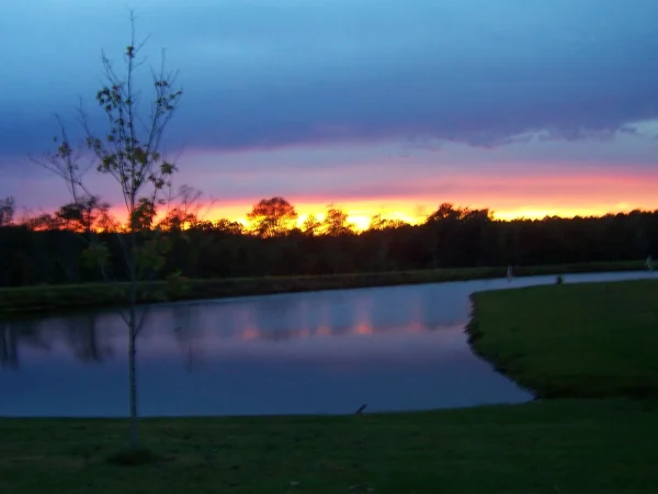 Sunset at Deer Run RV Park – Troy, Alabama Sunset over a pond at Deer Run RV Park in Troy, Alabama